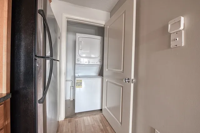 a view of closet with wooden floor
