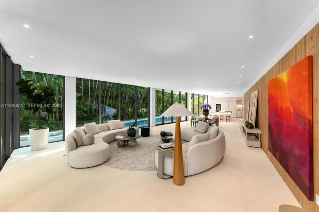 a kitchen with granite countertop a stove a sink and a refrigerator