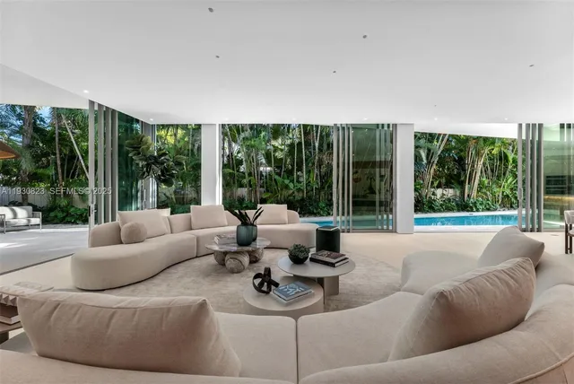 a bed room with a bed and a large window