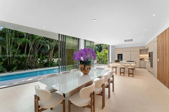 a view of an outside dining space with furniture