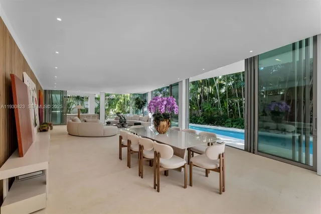 a view of a kitchen with a sink and dishwasher a stove top oven with wooden floor