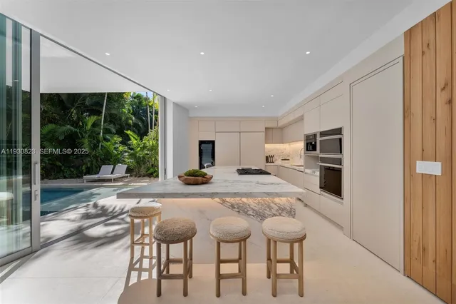 a view of a patio with table and chairs and potted plants