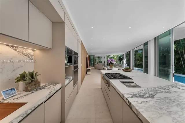 a view of a patio with table and chairs and potted plants