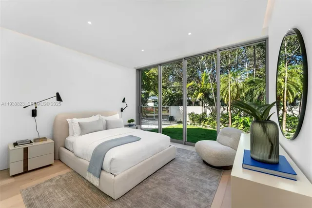 a view of a chairs and table in backyard