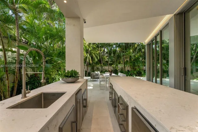 a balcony with furniture and a potted plant
