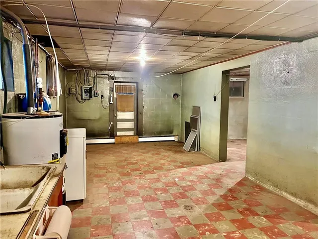 a view of a hallway with a refrigerator