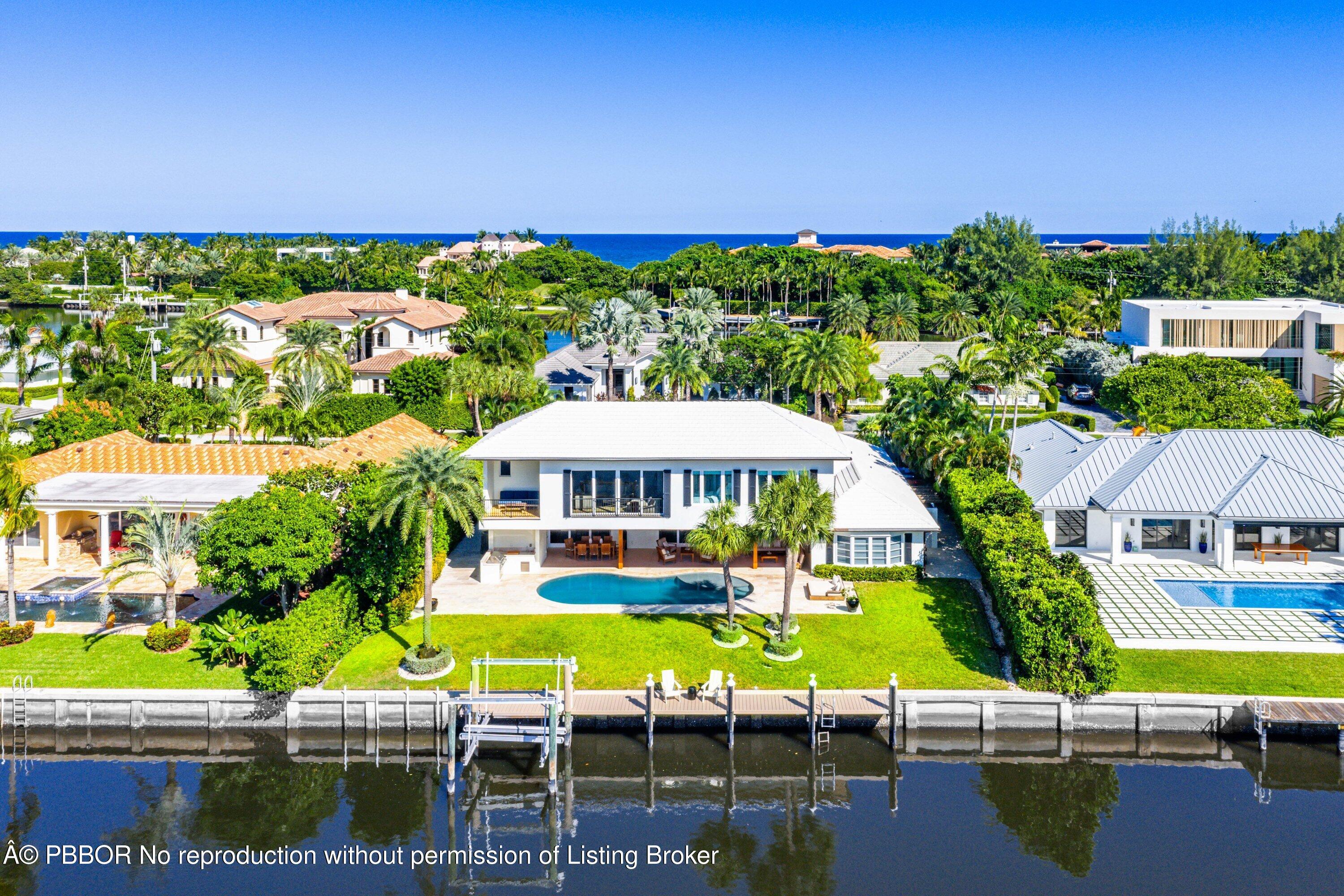 50 Spoonbill Road Lantana, FL 33462 - Photo 28 of 37 an aerial view of residential houses with outdoor space and swimming pool