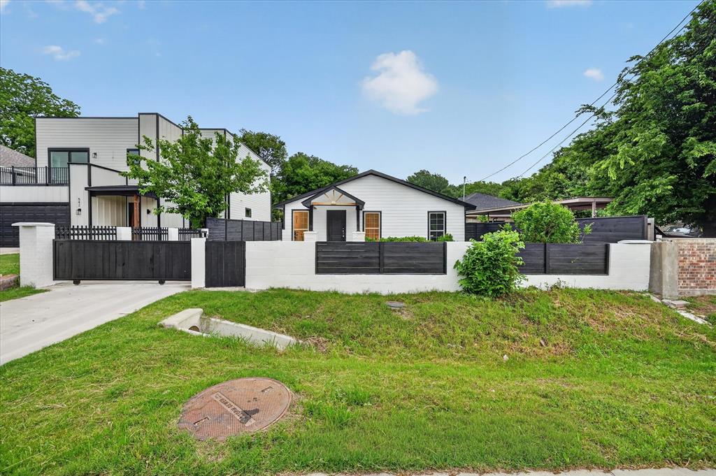 538 Pemberton Hill Road Dallas, TX 75217 - Photo 3 of 31 Modern two-story exterior featuring white siding with black trim accents