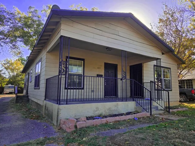 a view of backyard of a house