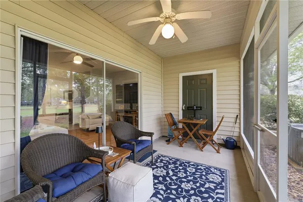 front view of a brick house with a yard