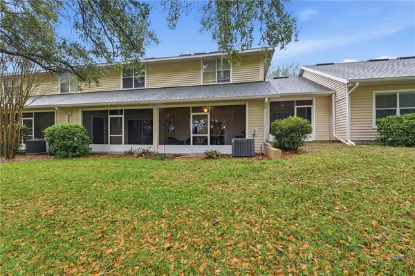 a view of outdoor space with garden and trees