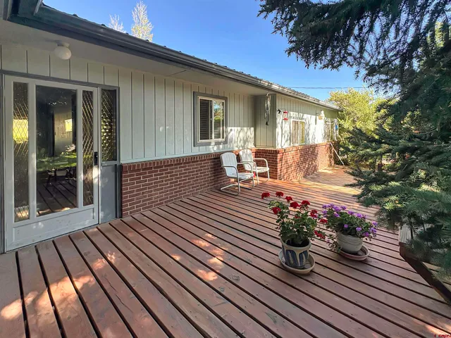 a view of balcony with wooden floor