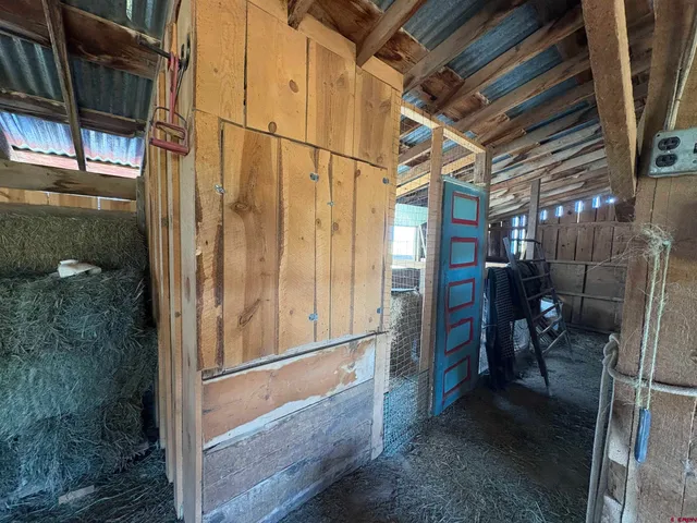 a view of a garage room with windows