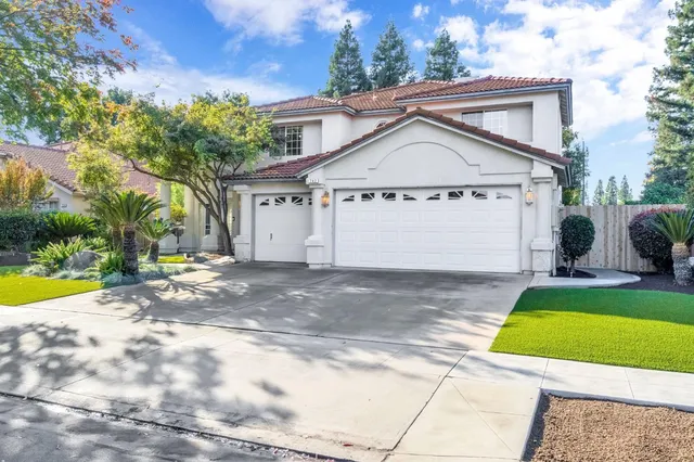 a view of backyard of house with outdoor seating