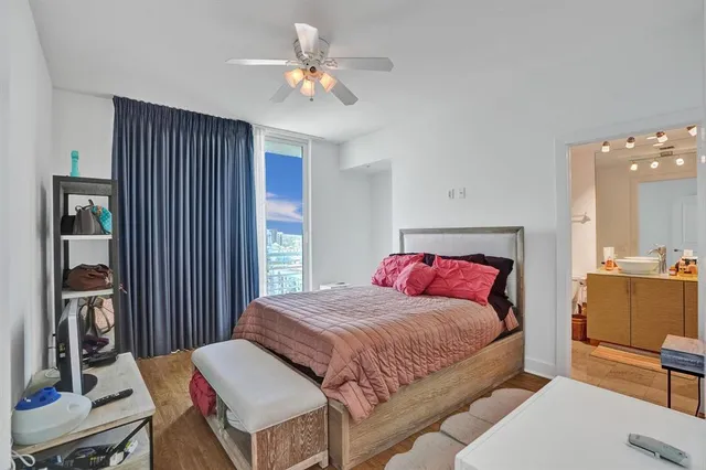 a bathroom with a double vanity sink and a bathtub