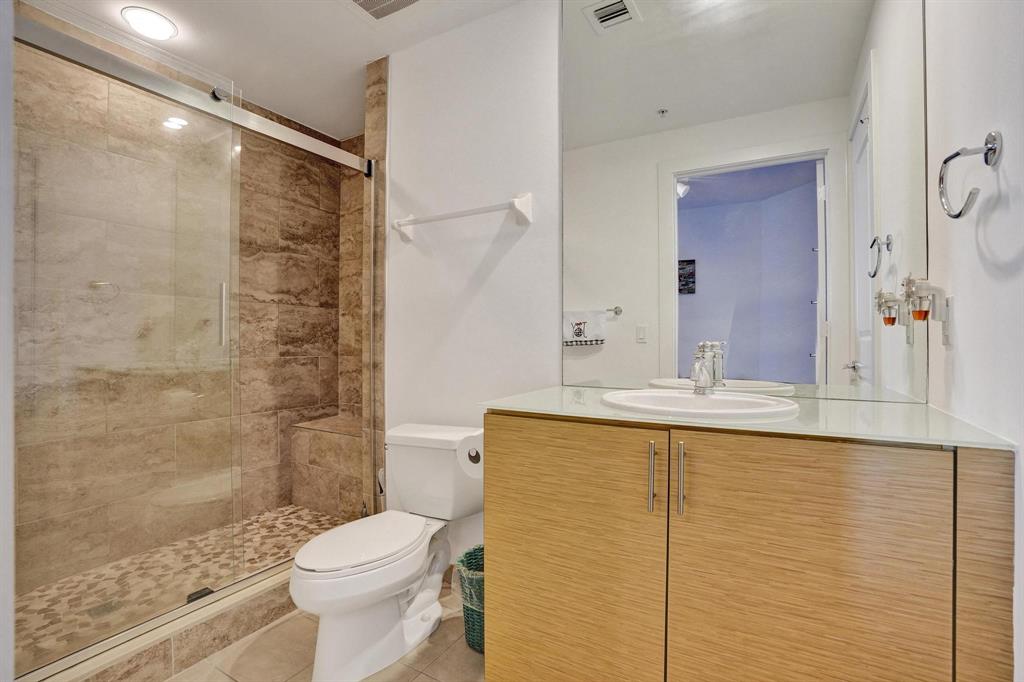 315 Northeast 3rd Avenue, Unit 1201 Fort Lauderdale, FL 33301 - Photo 17 of 49 a bathroom with a sink toilet and shower