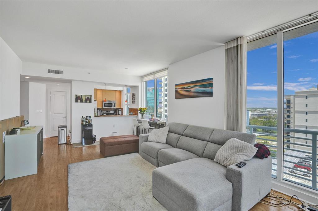 315 Northeast 3rd Avenue, Unit 1201 Fort Lauderdale, FL 33301 - Photo 2 of 49 a living room with furniture and a view of kitchen