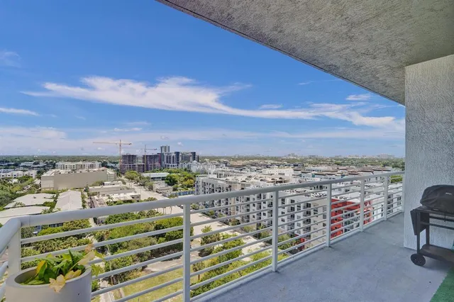 a view of a swimming pool with outdoor seating