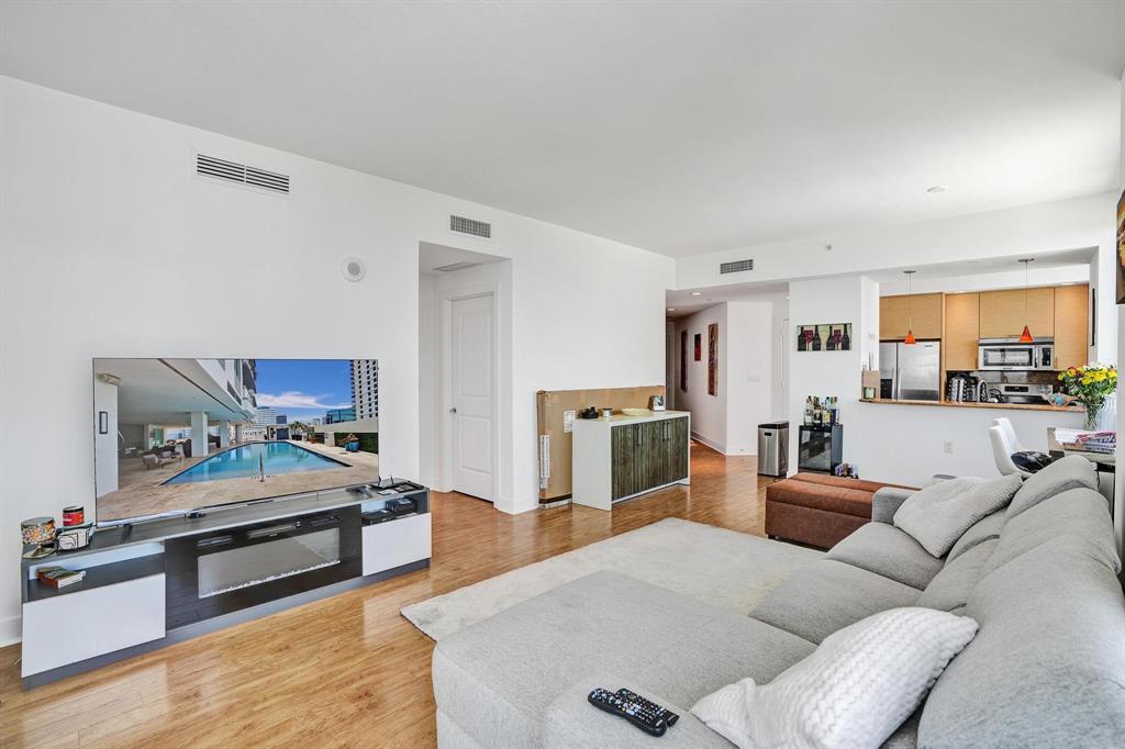 315 Northeast 3rd Avenue, Unit 1201 Fort Lauderdale, FL 33301 - Photo 3 of 49 a bedroom with furniture and a view of kitchen