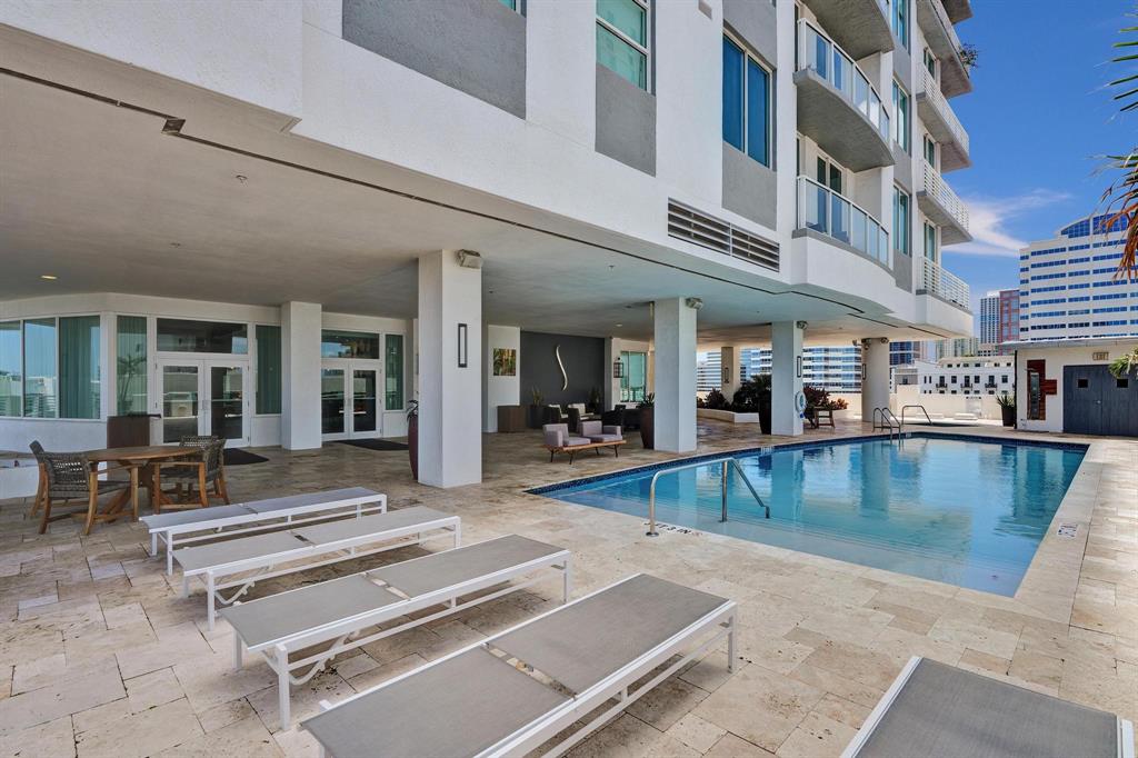 315 Northeast 3rd Avenue, Unit 1201 Fort Lauderdale, FL 33301 - Photo 38 of 49 a view of a swimming pool with outdoor seating