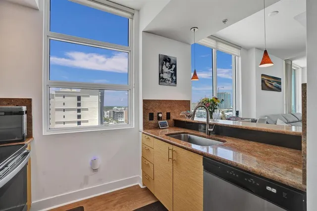 a kitchen with a sink and a refrigerator