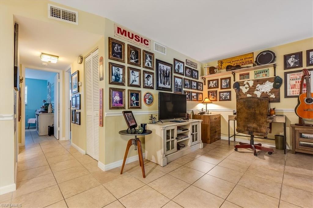 4290 Gulfstream Drive, Unit 4 Naples, FL 34112 - Photo 11 of 20 a view of a livingroom with workspace and a window