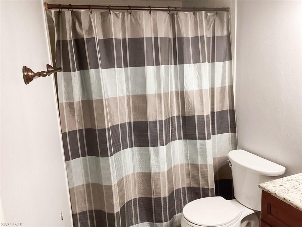 4290 Gulfstream Drive, Unit 4 Naples, FL 34112 - Photo 20 of 20 a bathroom with a sink and toilet