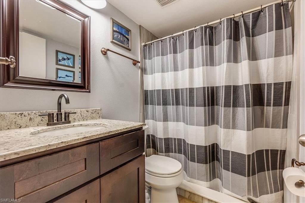 4290 Gulfstream Drive, Unit 4 Naples, FL 34112 - Photo 3 of 20 a bathroom with a sink and toilet