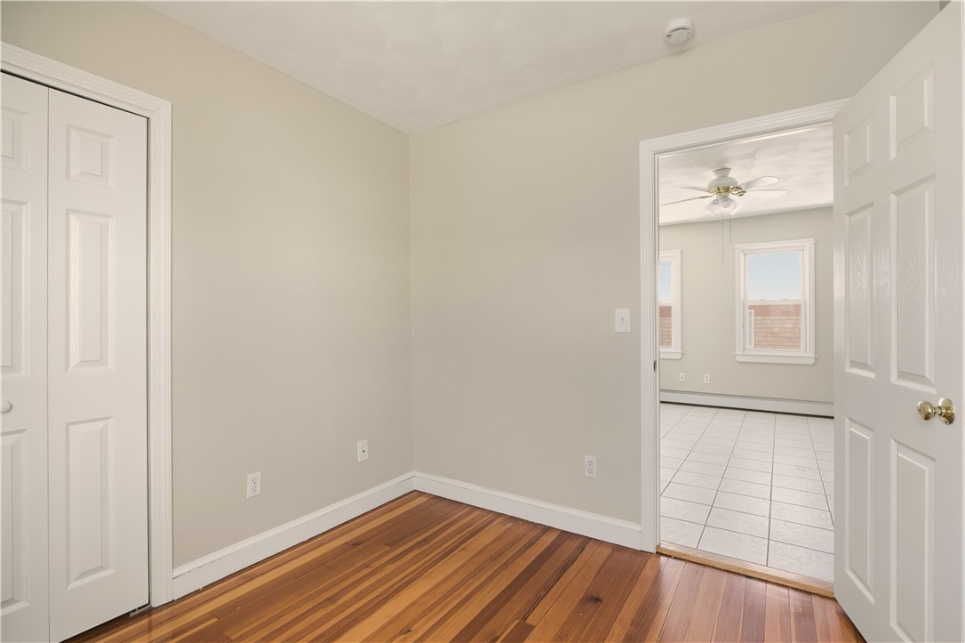 293 State Street Bristol, RI 02809 - Photo 11 of 48 1st floor second bedroom, looking into kitchen
