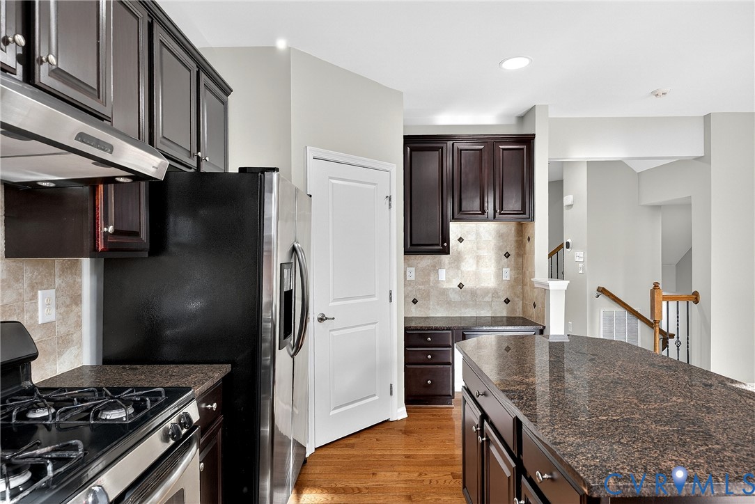 1903 Old Brick Road Glen Allen, VA 23060 - Photo 15 of 39 a kitchen with stainless steel appliances granite countertop a refrigerator and a stove top oven