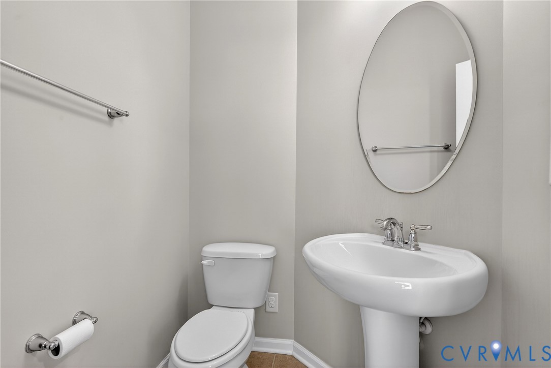 1903 Old Brick Road Glen Allen, VA 23060 - Photo 25 of 39 a bathroom with a toilet a sink and a mirror