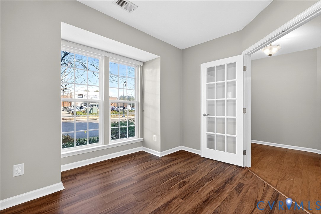 1903 Old Brick Road Glen Allen, VA 23060 - Photo 4 of 39 an empty room with wooden floor and windows