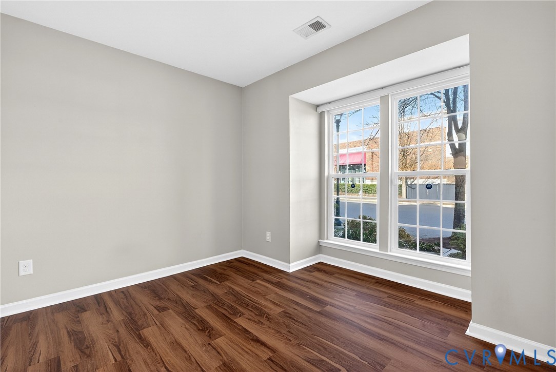 1903 Old Brick Road Glen Allen, VA 23060 - Photo 6 of 39 a view of an empty room with wooden floor and a window