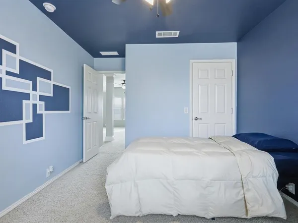 a large white bed in a white room