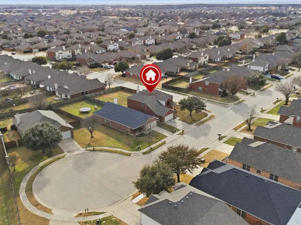an aerial view of a house with a swimming pool