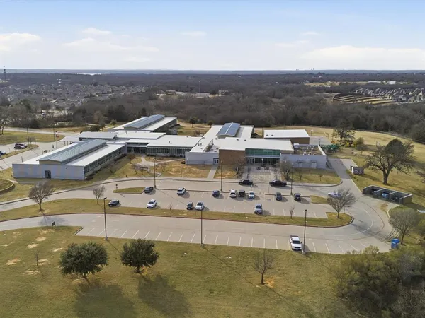 a view of a terrace with a table and chairs