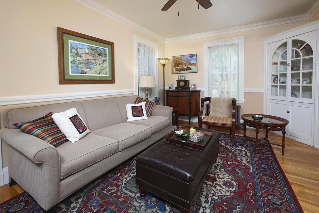 84 Lake Shore Road Boston, MA 02135 - Photo 5 of 10 a living room with furniture a rug and a window
