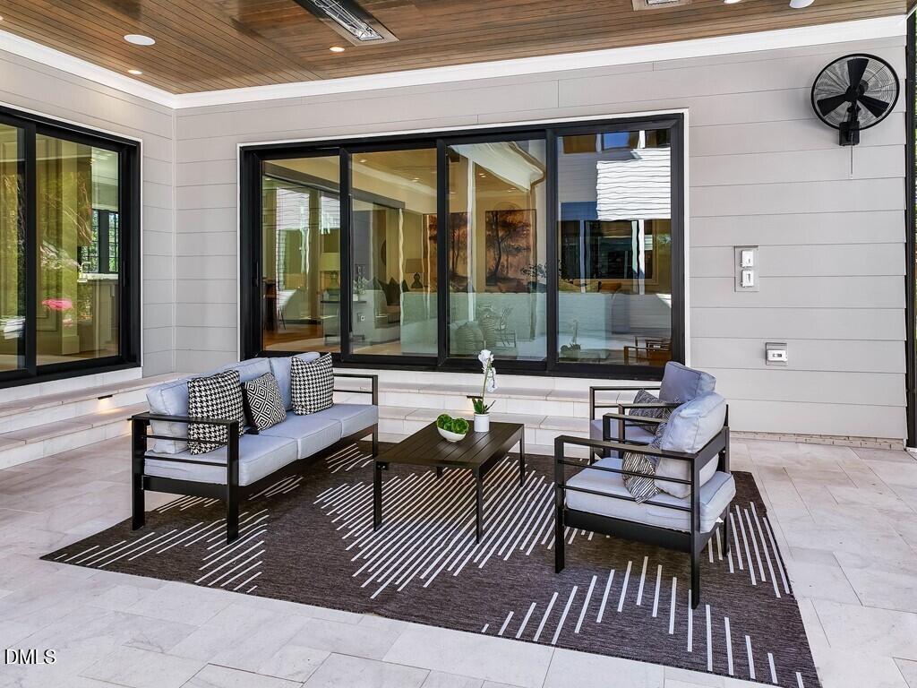 7013 Buckhead Drive Raleigh, NC 27615 - Photo 71 of 80 a outdoor living space with furniture and a rug