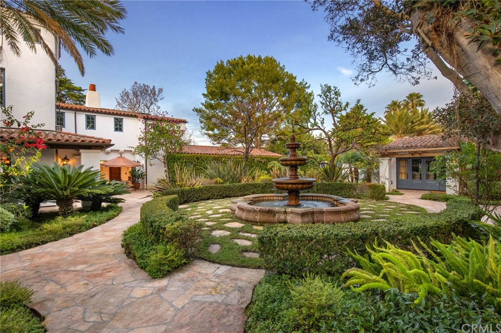 909 Vía Coronel Palos Verdes Estates, CA 90274 - Photo 11 of 59 a view of a house with swimming pool and a garden