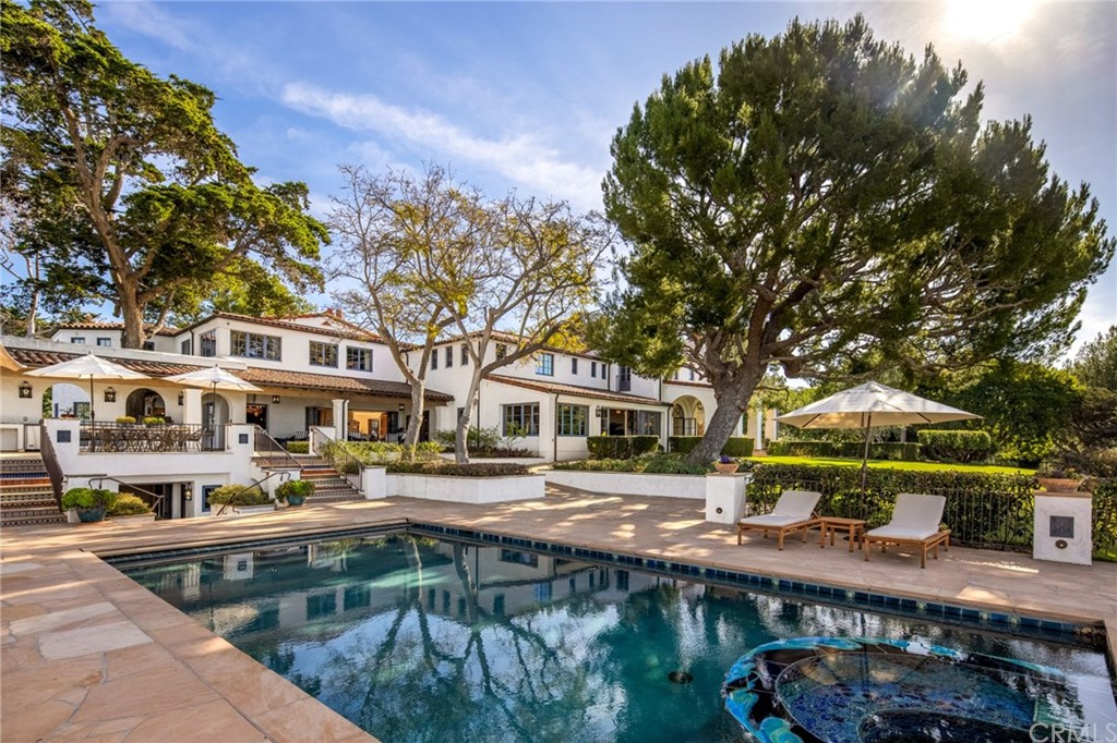 909 Vía Coronel Palos Verdes Estates, CA 90274 - Photo 14 of 59 a front view of a building with river and trees