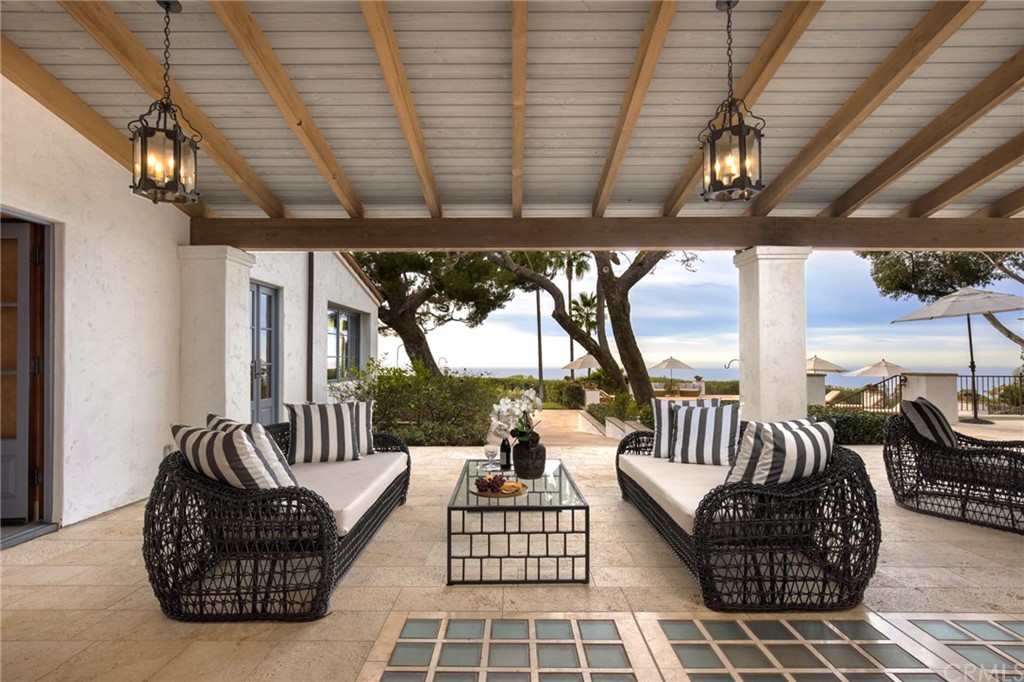909 Vía Coronel Palos Verdes Estates, CA 90274 - Photo 18 of 59 a living room with furniture and a floor to ceiling window