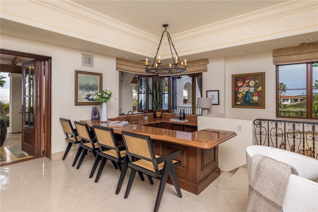 909 Vía Coronel Palos Verdes Estates, CA 90274 - Photo 28 of 59 a view of a dining room with furniture and chandelier