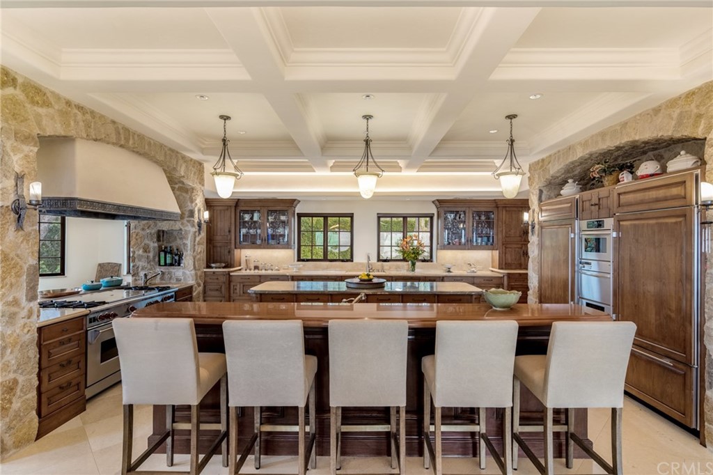 909 Vía Coronel Palos Verdes Estates, CA 90274 - Photo 29 of 59 a dining area with stainless steel appliances granite countertop a dining table and chairs