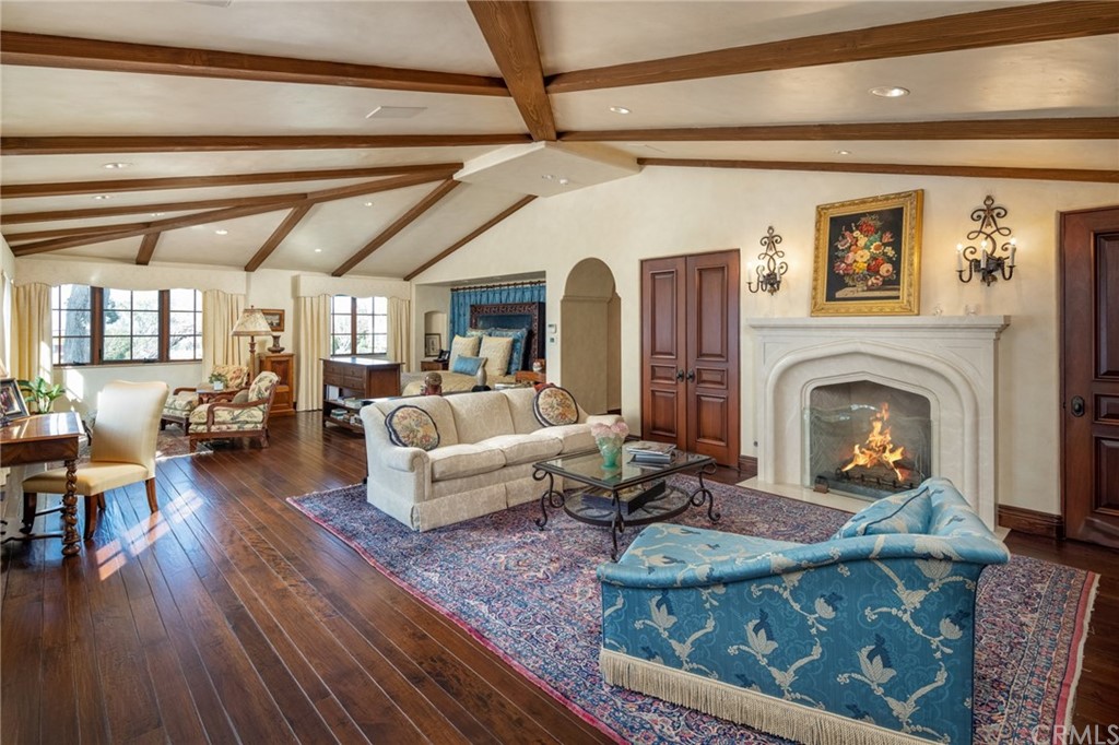 909 Vía Coronel Palos Verdes Estates, CA 90274 - Photo 35 of 59 a living room with furniture fireplace and wooden floor