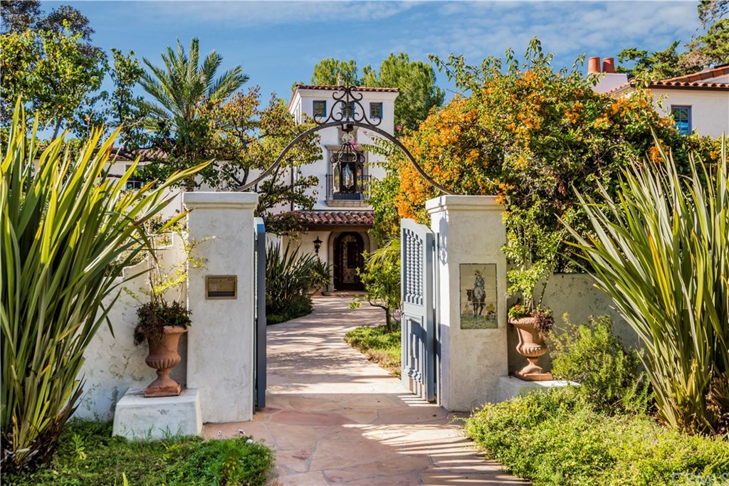 909 Vía Coronel Palos Verdes Estates, CA 90274 - Photo 5 of 59 a front view of a house with a yard and tree s
