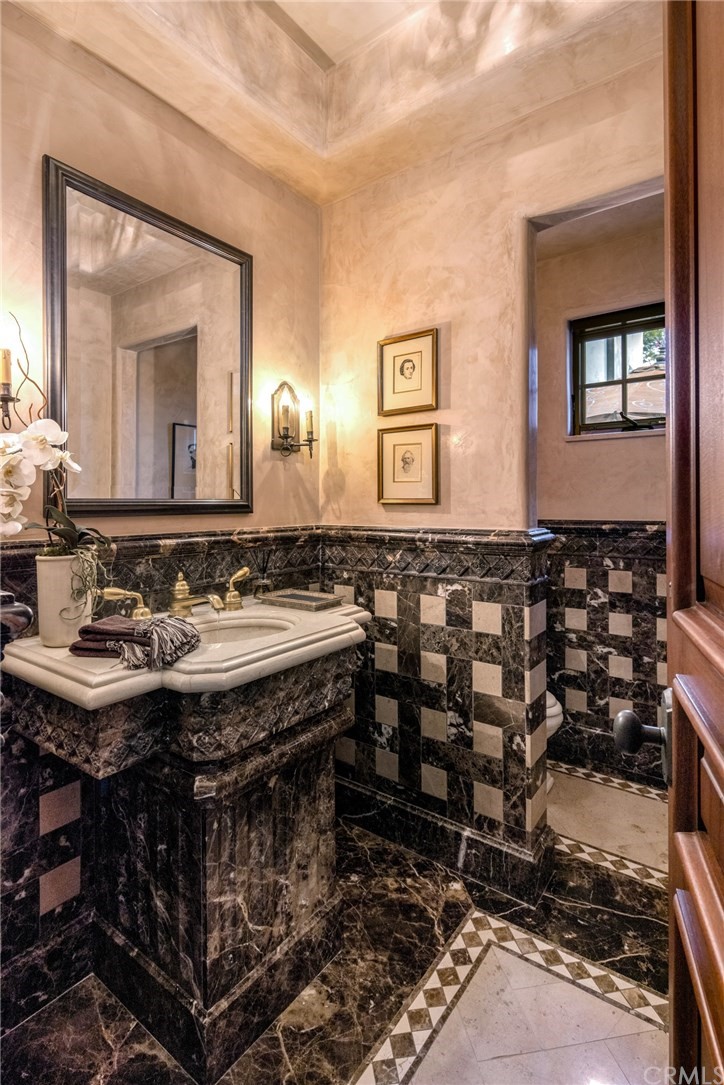 909 Vía Coronel Palos Verdes Estates, CA 90274 - Photo 55 of 59 a bathroom with a sink and a mirror