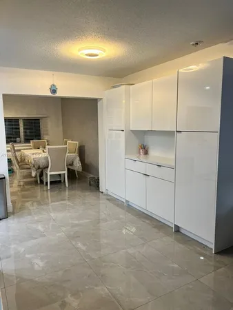 a bedroom with furniture and a chandelier