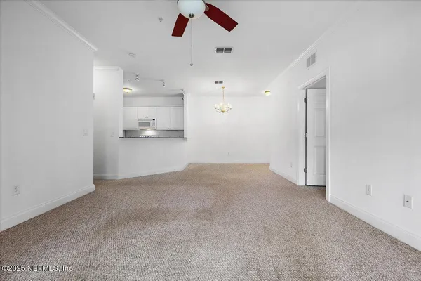 a view of a kitchen with a sink and dishwasher in it