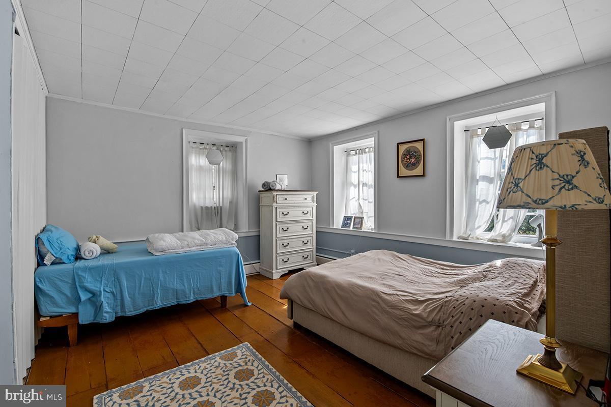 3059 Peters Mountain Road Halifax, PA 17032 - Photo 29 of 43 a bedroom with a bed and a couch