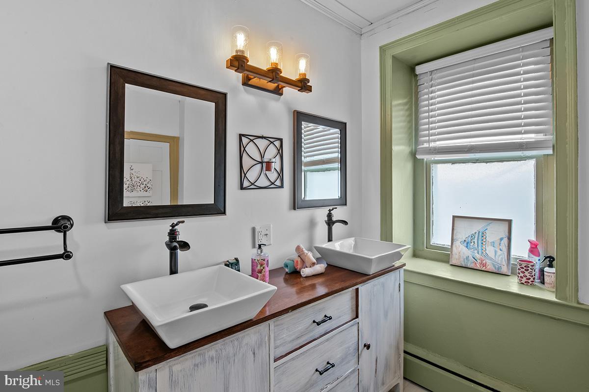 3059 Peters Mountain Road Halifax, PA 17032 - Photo 33 of 43 a bathroom with a sink and a mirror